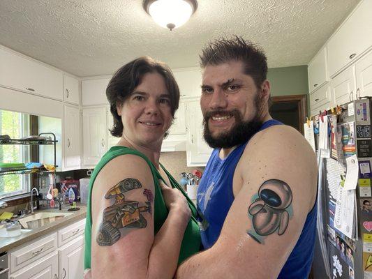 Finished WALL-E and EVE tattoos after coverings have been removed and washed and lotioned.