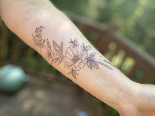 Forearm floral tattoo