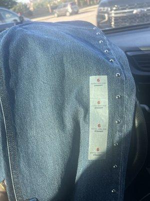 Jeans with sticker still on them