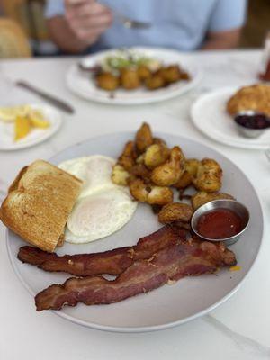Classic Breakfast - 2 eggs over easy, sourdough toast, bacon, and potatoes