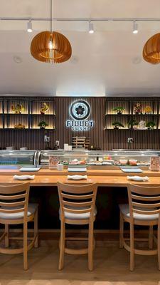 Our sushi bar, where every cut is prepared fresh right in front of you. Premium fish, clean technique, and a calm intimate atmosphere.