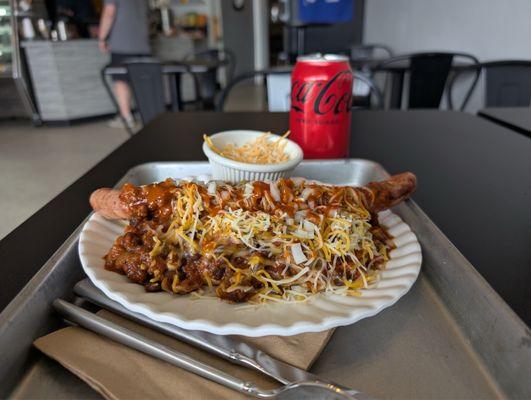 Chili cheese dawg with xtra cheese, any your choice of beverage.