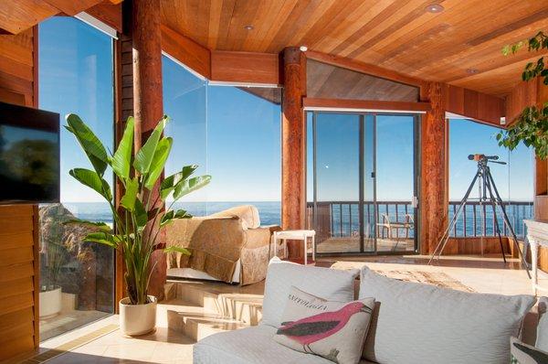 Another contemporary home in Otter Cove sets above two private coves with adorable sea otters.