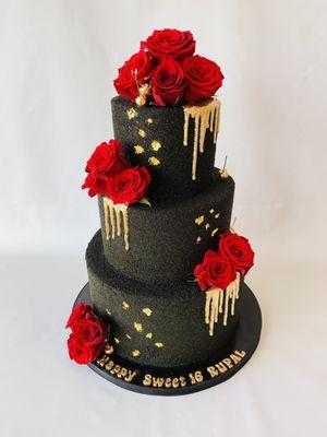 Black, red and gold Sweet 16 cake