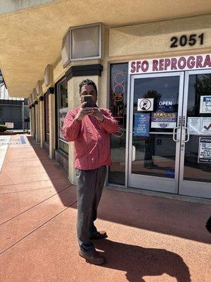 Unhinged owner threatening his customer outside.