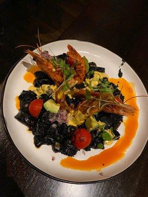 Squid ink rice with prawns and calamari