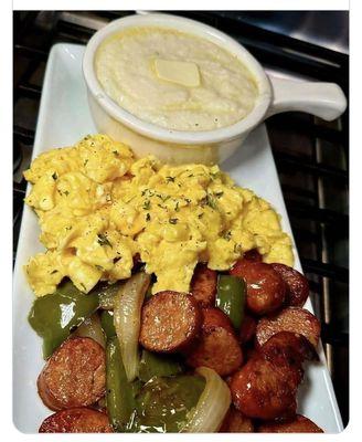 Cheese grits and butter eggs and beef sausage with bell pepper and onions
