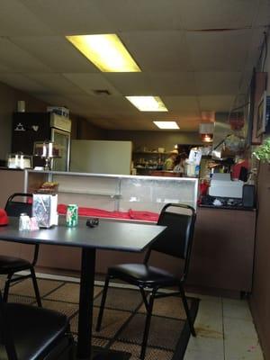 Inside the cafe...small and cozy. Three booths, four tables.