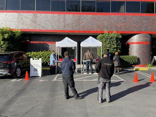 They had 2 or 3 people being tested at once- you swab your own cheek and throat.