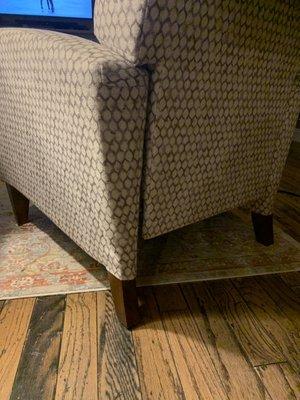 Fold in fabric and gap in chair.