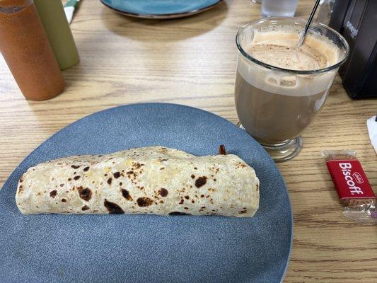 Wild Taco with beans, cheese, bacon, country sausage, and chorizo con huevo, and a tiramisu latte.