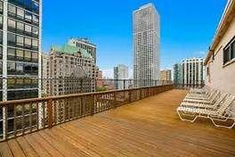 New deck loaded and constructed on the 23rd floor of 33-East Cedar, Chicago. Loaded all of the timber with our own rooftop crane.