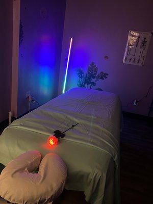 Massage table and chromotherapy light.