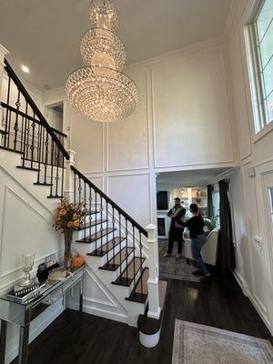 Our entryway transformation features decorative wainscoting and paneling that elevate the foyer to a new level of sophistication. The elegan