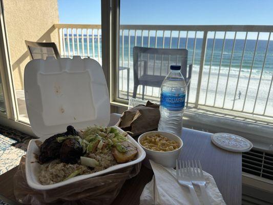 Jerk chicken, macaroni and cheese, and coco bread.