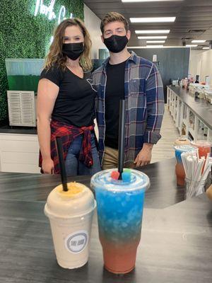 Taylor-co owner with coworker and beautiful shake and teas.