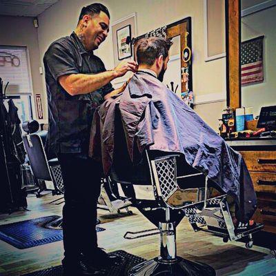 Ricardo Cutting a Customer