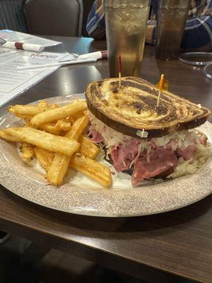 The Rueben - Corned beef, Swiss, and sauerkraut with thousand island dressing on marbled rye