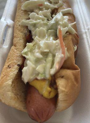 Hot dog with chili, mustard, and slaw