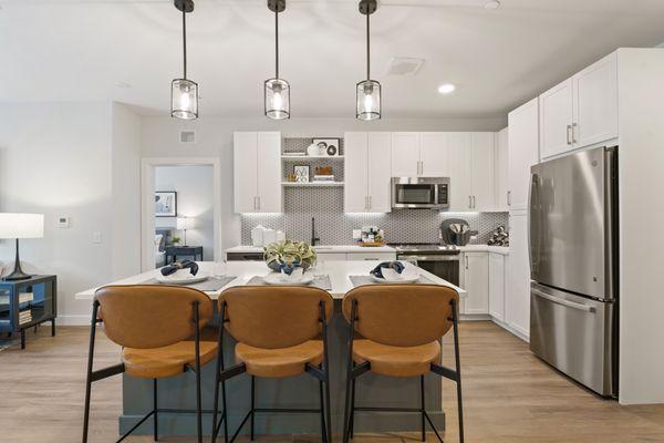 Kitchen with stainless steel appliances and pendant lighting
