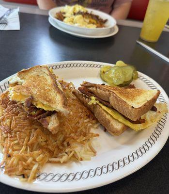 Sausage hashbrown bowl and Texas bacon egg cheese sandwich.