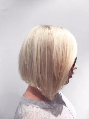 Long bob (lob) asymmetrical and white frosty blonde by Denessa Sims.
