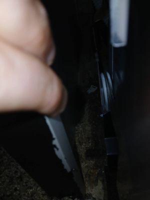 The end cabinet divider is not properly secured to either the wall or the counter