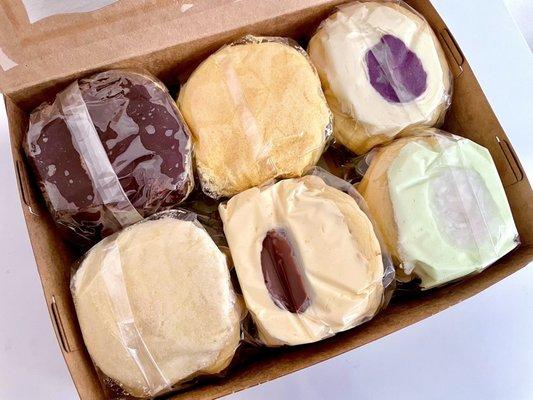 Boston creme, mango, ube halaya, classic cheese, banana chocolate, coconut pandan
