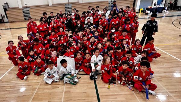 All our intermediate & advance students celebrating with their new belts.