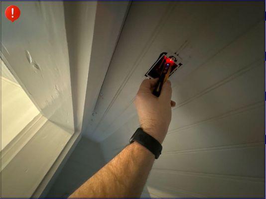 Live exposed wiring in a closet.