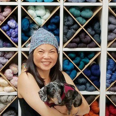 Customer in a hat made from their yarn! (Did we mention the shop is very dog-friendly?!)