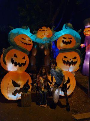 My kids posing at a trailer's Halloween set up.