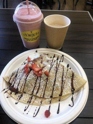 Strawberry shake,Nutella crepes with banana and strawberries, and capuchino
