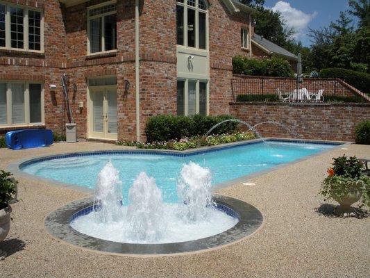 The original pool did not have fountains or deck jets until we showed up!  Want to transform your pool?  Give us a call today!