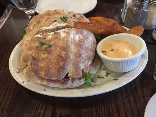 Coldcut sandwich with fries and dipping sauce.