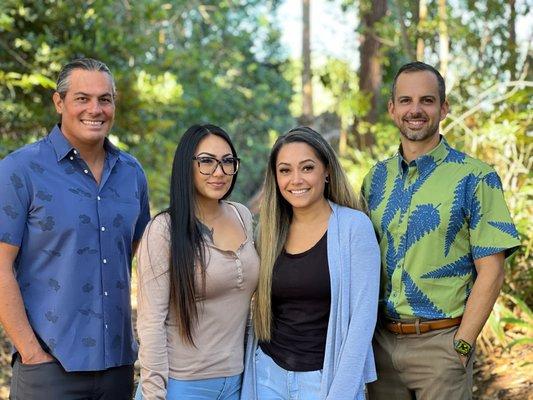 Our Team: Attorney W. Kumu Belcher, Administrative Assistant Ashley Martinez, Paralegal Krystal Kauka, and Attorney John Roth