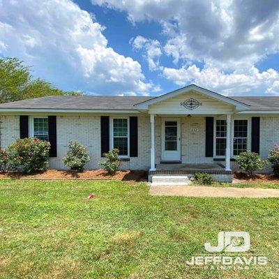 Single-level brick home after limewashing