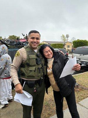 Happy Owner gets her Property Back after 8 long Months. you can see one of the Squatters behind the deputy.