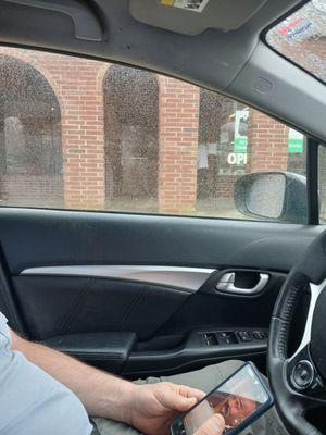 He's running to move those deliveries!(outside the window)