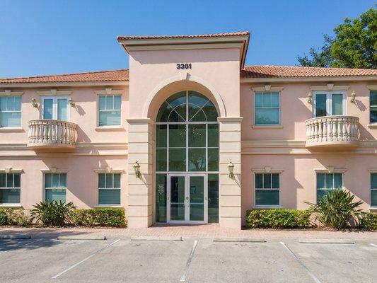 Exterior view of Skin Place Institute located at 3301 NW 2nd Ave in Boca Raton, featuring the main entrance and surrounding landscaping.