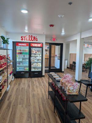 Shop and fridge has cold drinks and breads to warm up