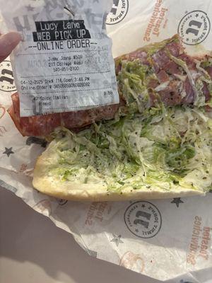 A recipt that says no mayonnaise and a sandwich full of mayonnaise