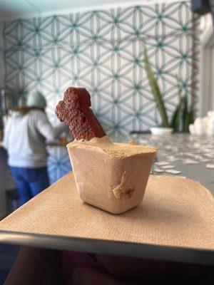 It's a prototype doggie treat! I'd call it a "banana pupsicle!"