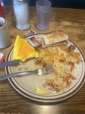 Ham and cheese omelette hash browns and toast. Coffee. 10.50 +