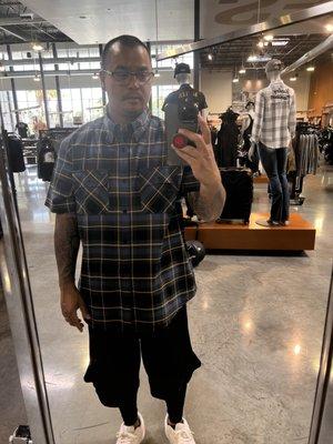 Blue and yellow button up with Harley racing division on back.