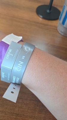 Wristband with drink coupons attached