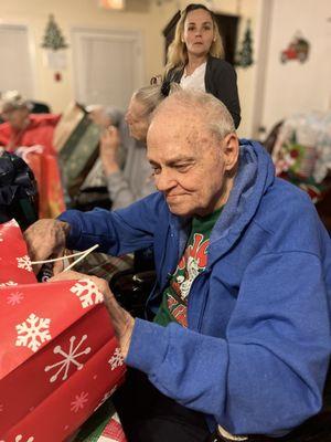 Having good time opening presents.