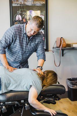 Dr. Muller adjusting a patient.