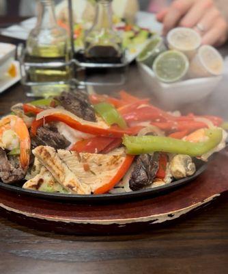 Platter shrimp steak peppers chicken