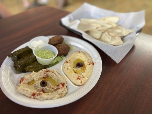 Sampler-grape leaves, falafel, hummus, baba gamoush, jalapeño salsa and pita.
